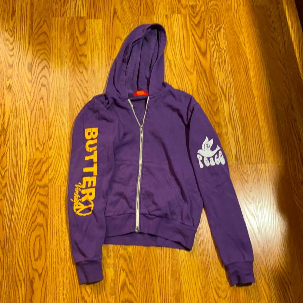 Butter purple zip up sweatshirt, deigns on sleeves and back, kids large